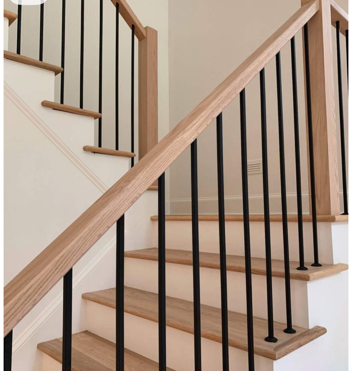 Hardwood staircase with custom railing finish